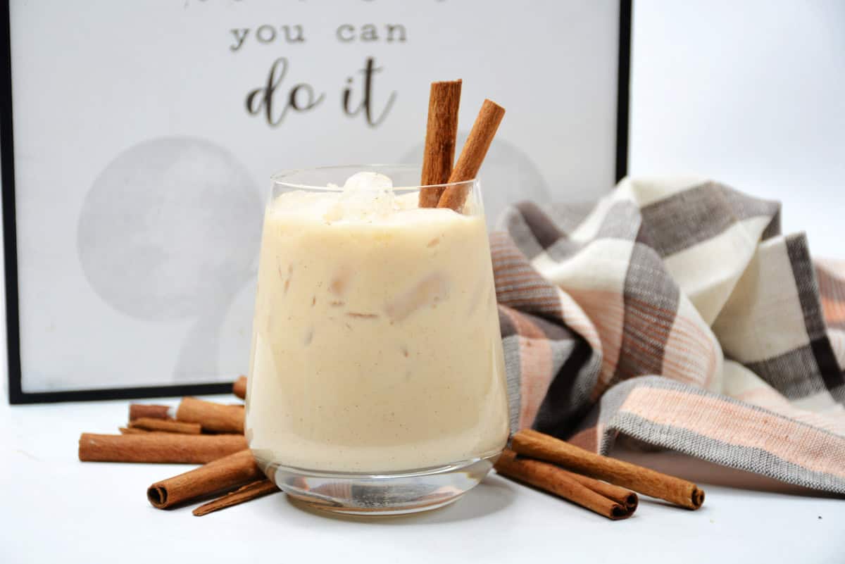mexican cocktail in a glass with sticks of cinnamon
