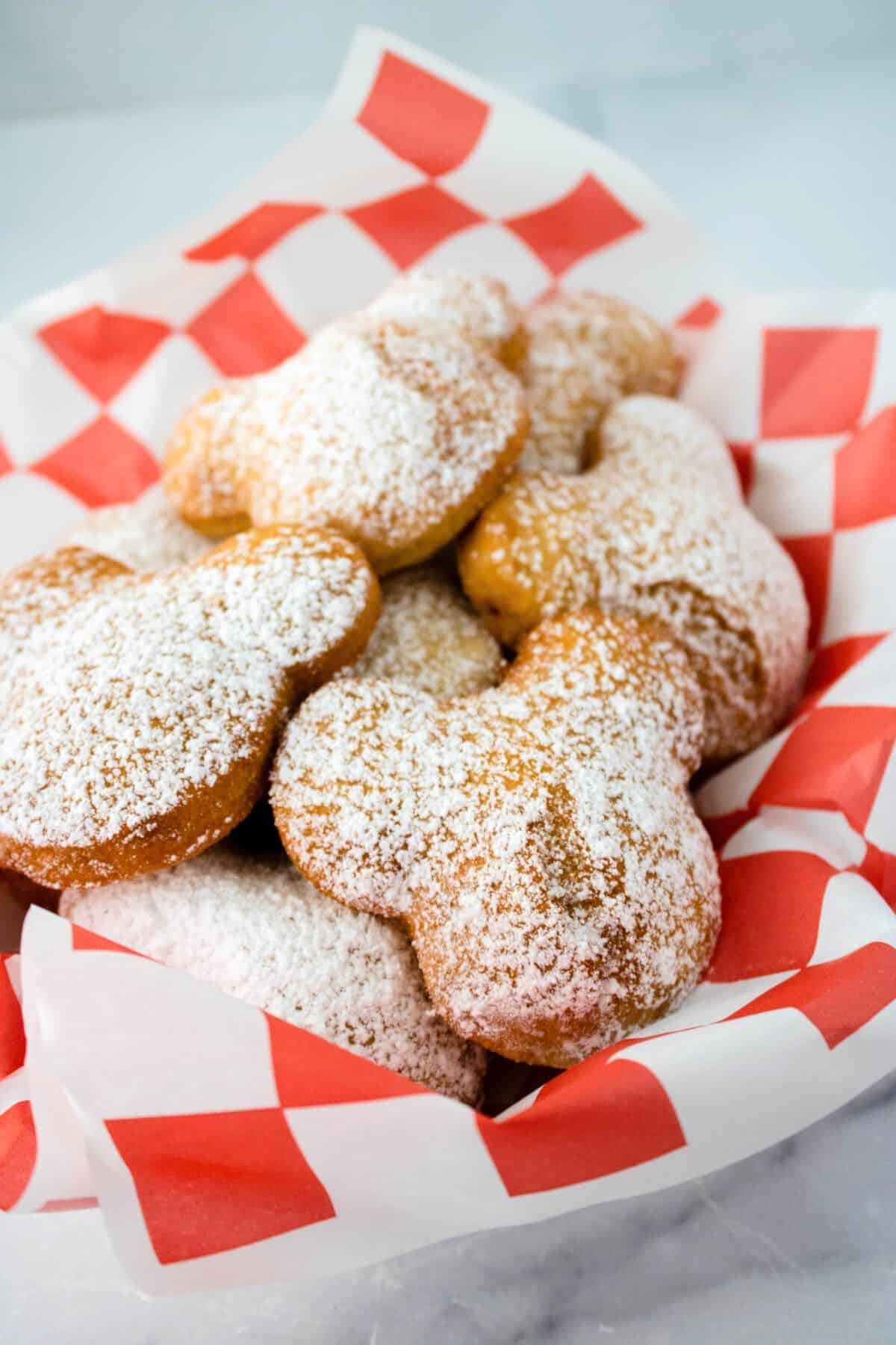 golden mickey pastries in a basket