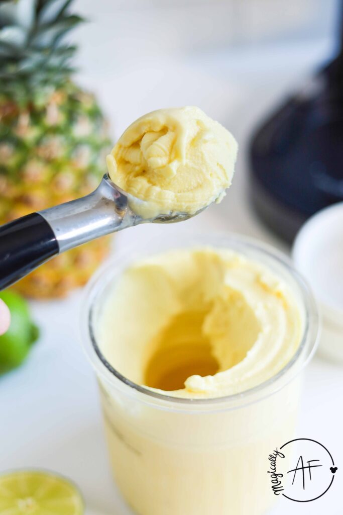 scooping up dole whip ice cream with an ice cream scooper 