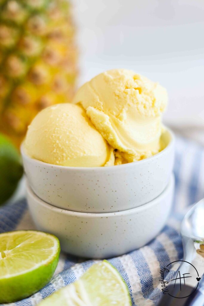 scooped pineapple ice cream in a white bowl 